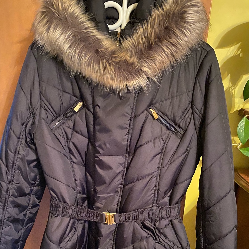 Black winter coat with faux fur hood trim. Like new.